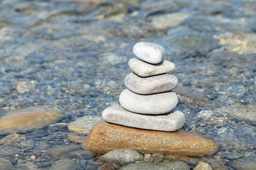 Fototapeta na wymiar Zen stones in water - world balance meditation relaxation concept