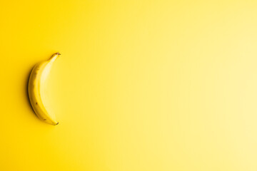 Close up of banana and copy space on yellow background