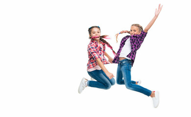 girls friends having fun and jumping. friendship of two children. happy girls sisterhood. children have fun together. bond of sisterhood and friendship. Sisters by heart. copy space