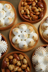 Fototapeta na wymiar Many different tartlets on golden tray, top view. Delicious dessert