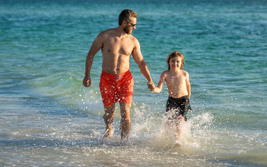 Father son bonding enjoying summer vacation. Special moments between dad and son child at sea. Father son adventures. Unconditional love. dad man and son kid running in sea beach