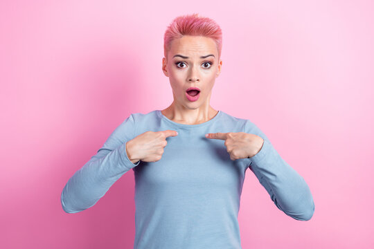 Photo of astonished nice woman with short haircut dressed blue sweatshirt directing herself staring isolated on pink color background