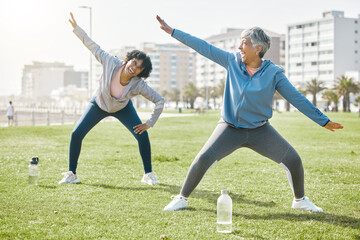 Women, senior and stretching in park, laugh with fitness and wellness, flexibility and start...