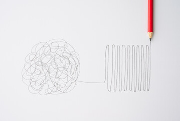 Flat lay of pencil hand drawing line chaos to order on paper background. Concept of abstract...
