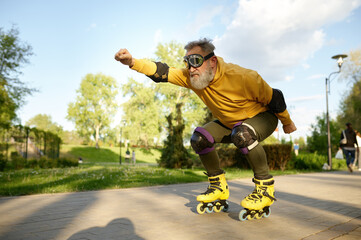 Funky mature man riding like aviator moving fast on roller skates