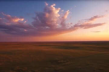Flight over the evening steppe in sunset colors.