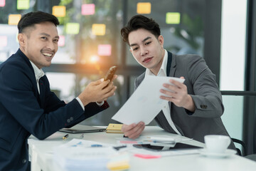 Technology and financial advisory services concert. Business teamwork and working on digital laptop computer with advisor showing plan of investment to clients at table office. Digital marketing.