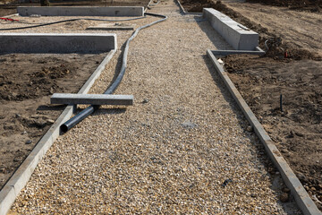 Construction of a footpath. Gravel base. preparation for asphalting paths in the park, the concept of renovation of walking paths in the park. copyright.