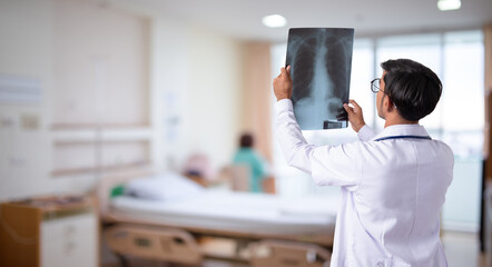 Doctor checking chest x-ray film in hospital - obrazy, fototapety, plakaty