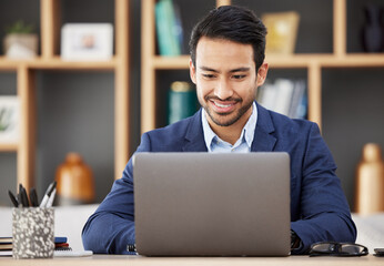 Man in office with laptop, smile and typing email, proposal or writing online report networking at startup. Happy businessman, computer and administration work for editing, copywriting or web search.