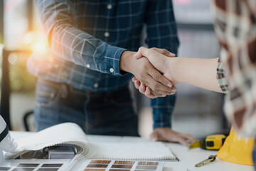 Asian engineer team and architects working designing planing of project, Engineer handshake, Home renovation concept.  