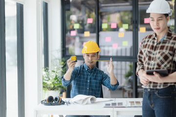 Asian engineer team and architects working designing planing of project, Home renovation concept.  