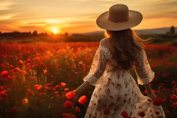 Gardinen Beautiful woman in rustic dress walking at poppy flowers field © kramynina