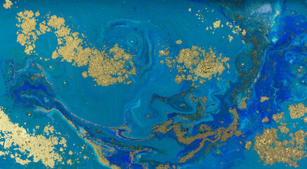 Fototapeta na wymiar Golden Dust on Liquid Blue Ink Wave Background.
