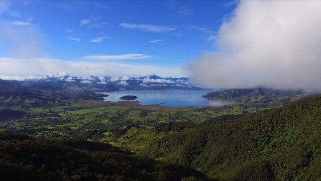 DRONE VIDEO OF "LA LAGUNA DE LA COCHA" IN PASTO NARI&Ntilde;O COLOMBIA AT SUNRISE. ZOOM IN
