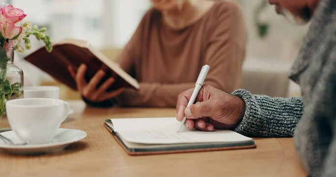 Hands writing, old people and bible in home for faith, religion or God with notes for worship in notebook. Studying closeup, holy books or Christian friends learning literature or spiritual prayer