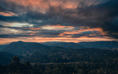 Serene Sunset Over Mountainous Landscape