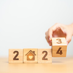 Happy New Year 2024 with Home and Heart block. Property investment, House Mortgage, Real Estate...