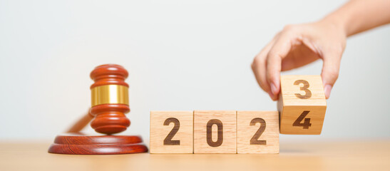 2023 chcnge to 2024 year block with judge gavel on table. Law, lawyer, judgment, justice auction...