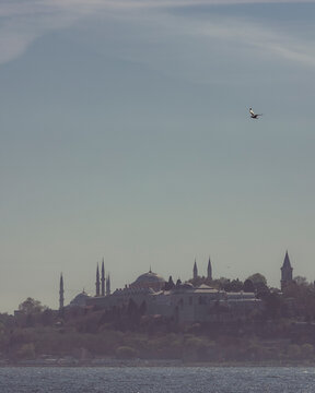 View of the Topkapi Palace and the Blue Mosque in Sultanahmet district on the Bosphorus Strait European side in Istanbul, Turkey.