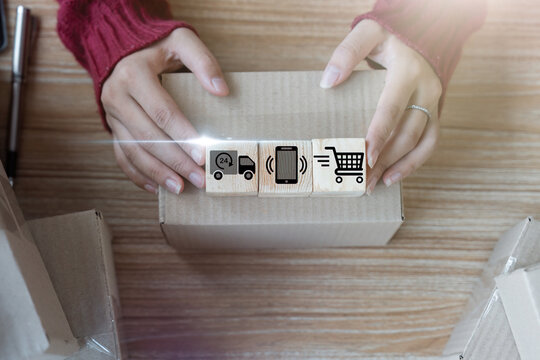 Hand arranging wood block with icon business strategy and business target concept online trading , distribution cycle e-commerce business concept. Order delivery service