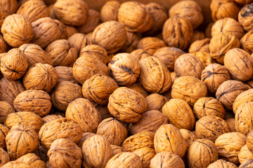 Natural walnut background pattern texture walnuts heap pattern background Natural food in-shell nuts walnuts pattern commercial backdrop