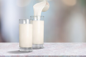 Fresh homemade kefir, milk or yogurt in glasses