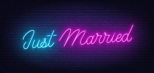 Fototapeta premium Just Married neon lettering on brick wall background.