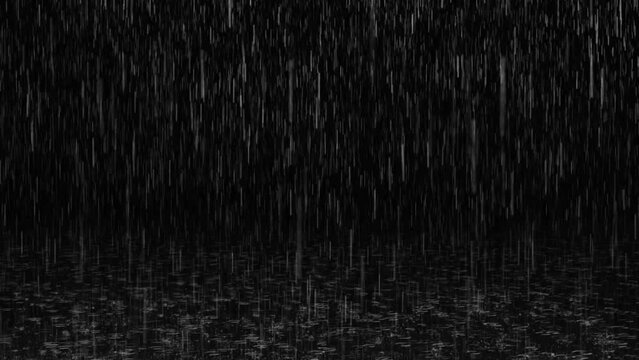 Heavy rain falling effect with clear visible splashes on ground in the dark background