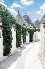 White ancient stone street in Alberobello, Italy 