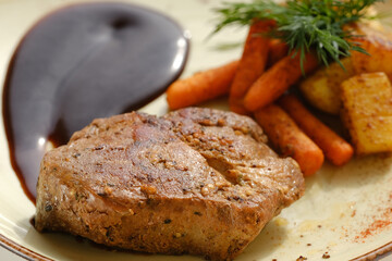 Juicy part of the neck, grilled with mini carrots, potatoes with BBQ sauce.