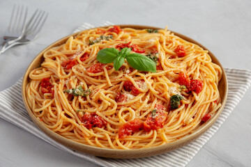 Homemade Spaghetti With Fresh Tomato Sauce on a Plate, side view.