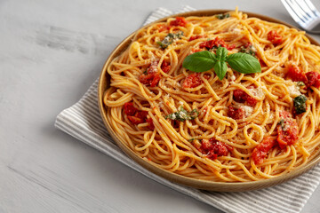 Homemade Spaghetti With Fresh Tomato Sauce on a Plate, side view. Copy space.