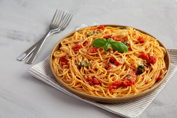 Homemade Spaghetti With Fresh Tomato Sauce on a Plate, side view.