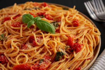 Homemade Spaghetti With Fresh Tomato Sauce on a Plate, side view. Close-up.