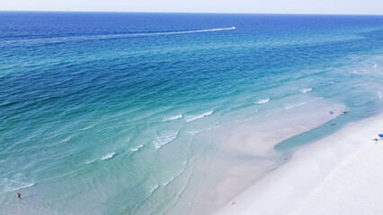 Aerial view brilliantly white sandy shore with crystal-clear turquoise water and gorgeous shade of blue waves along miles of untouched beaches Santa Rosa, Walton County, Florida, USA