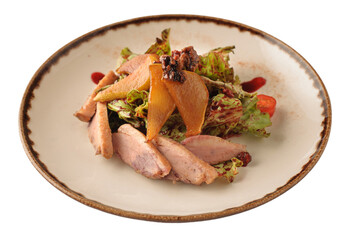 Salad leaves with spicy duck dressed with blackberry confit with caramelized pear and walnut, restaurant dish in a plate isolated on white.
