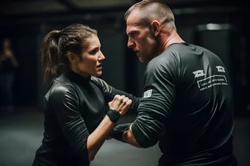 Fotobehang Empowerment in Action: Two individuals mastering a self-defense technique in a vigorous Krav Maga class, demonstrating effective real-world protection skills © Davivd