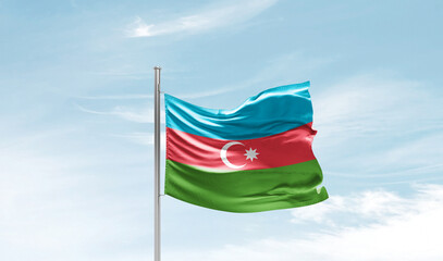 Fototapeta na wymiar Azerbaijan national flag waving in sky.