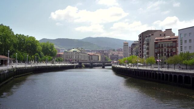 City center of Bilbao. Beautiful building architecture. View of River Nervion and his promenade area. Travel destination in North of Spain. Stabilized static video.