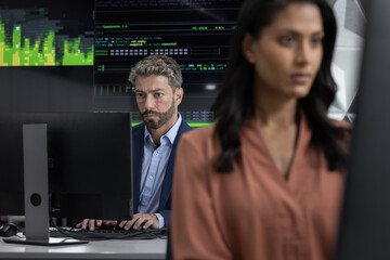 Male stock broker working in a trading office