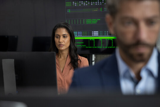 Female stock broker working in a trading office