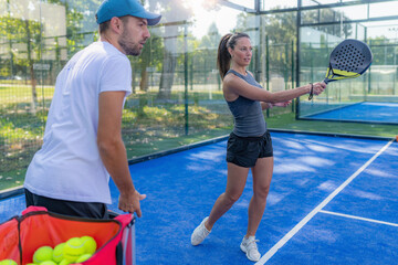 Padel tennis progress and skill development, coach conducts padel personal training sessions with a...