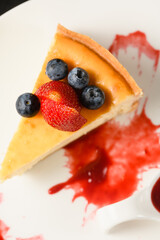 Appetizing dessert cheesecake on a white plate.