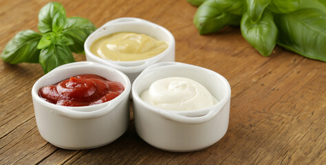 three types of sauces ketchup, mayonnaise and mustard