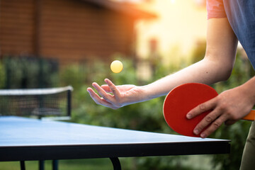 table tennis player doing a serve, close-up, The concept of sport and healthy lifestyle.