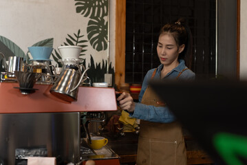 Asian young woman working at her coffee shop. Small business, Business owner.