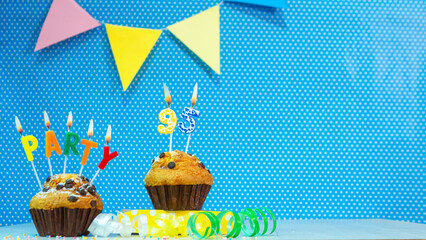 Festive muffin pie with candles for a birthday. Birthday background with numbers  95. Anniversary card on blue polka dot background, copy space