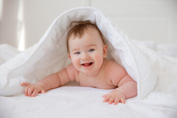 baby boy wrapped in a towel after bathing. The concept of child care and care about him