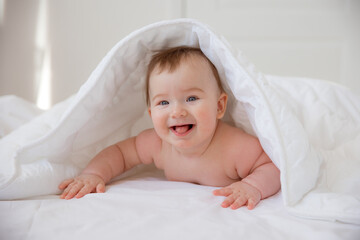 baby boy wrapped in a towel after bathing. The concept of child care and care about him
